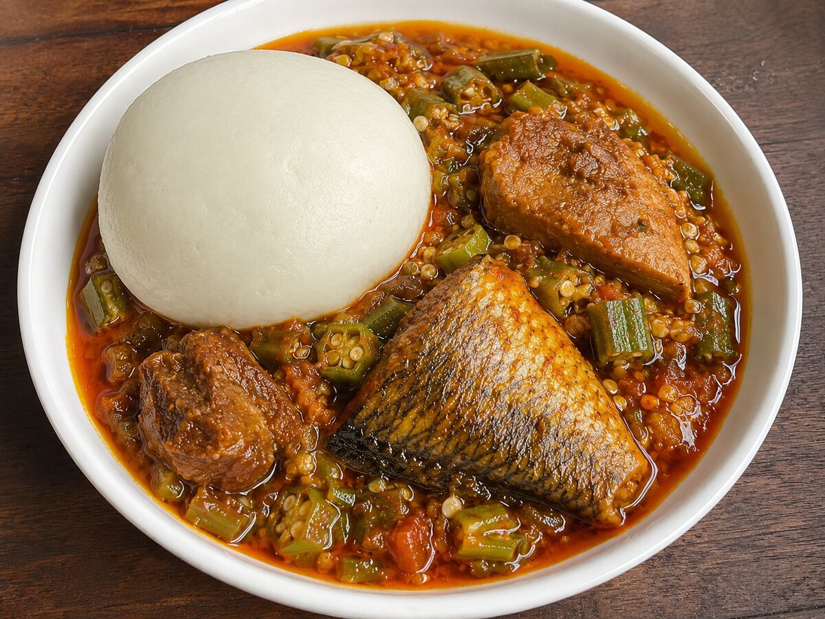 Banku and Okra Soup. Served with two balls of banku and 32 oz of okra soup , one piece of meat, & a piece of fish