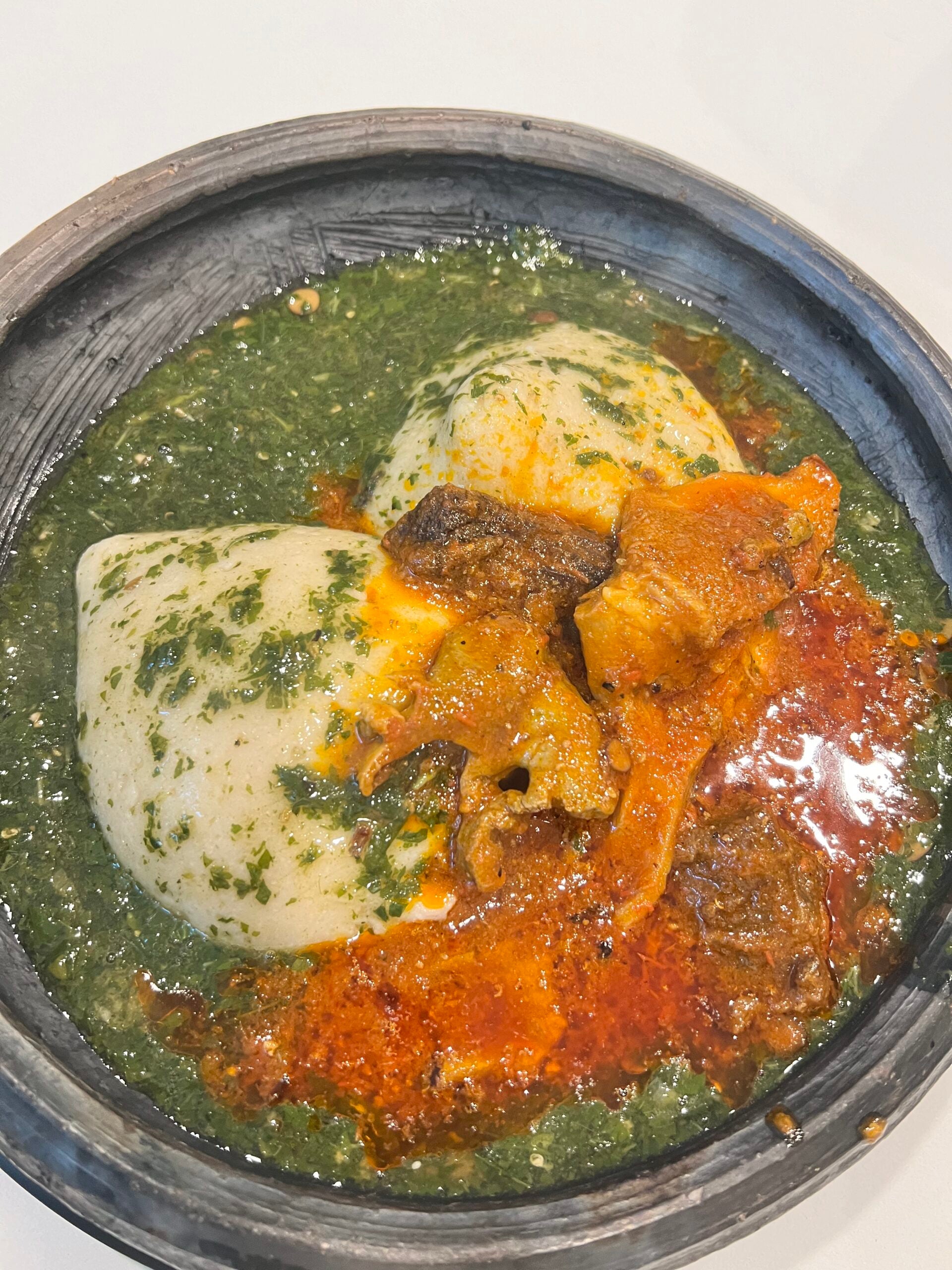 The Doctor’s Menu Special Tuo Zaafi combo. Served with 2 balls of Tuo Zaafi, 16oz jute leaves (Ayoyo) soup and 16 oz tomato base sauce with assorted proteins
